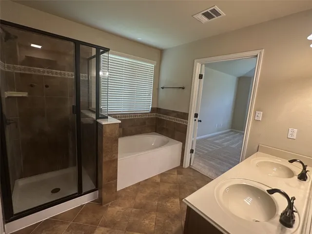a bathroom with a sink and a bathtub