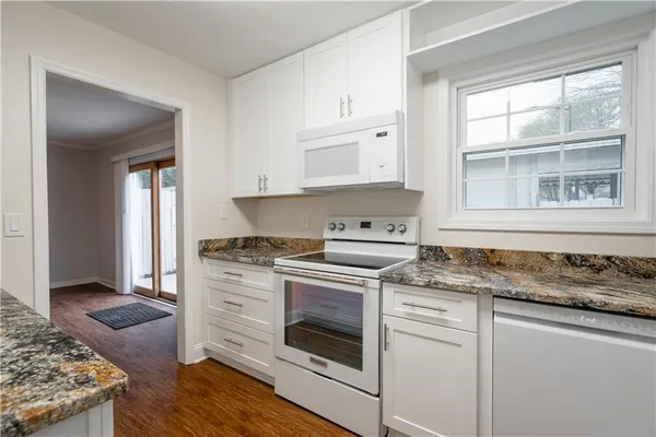 a kitchen with a stove and a sink