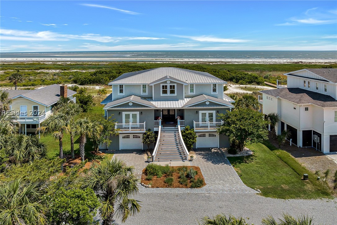 720 Swordfish Road Fripp Island, SC 29920 - Photo 1 of 1 View of front facade featuring covered porch, a ga