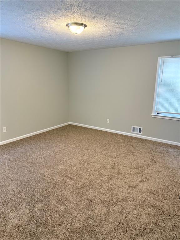 3990 Highway 92 Acworth, GA 30102 - Photo 16 of 25 an empty room with a natural light
