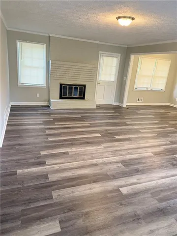a view of a ceiling fan and wooden floor
