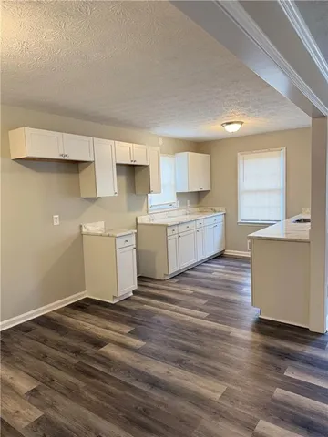 a view of kitchen with wooden floor