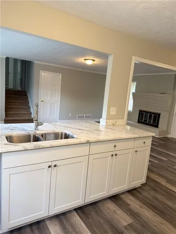 a bathroom with double sink and a mirror