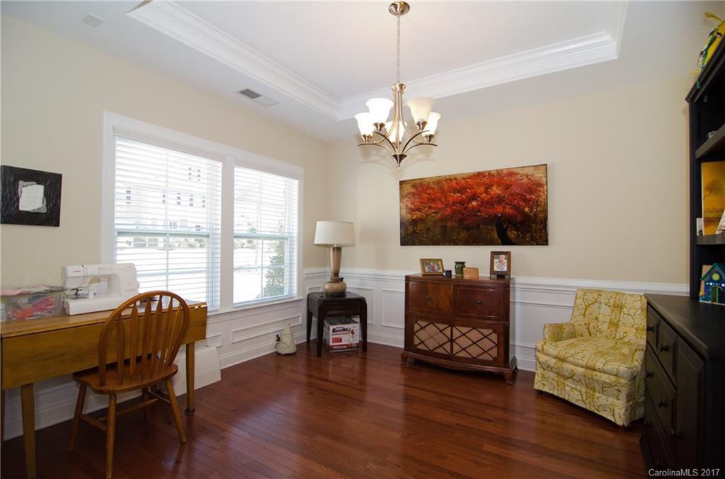 16827 Rudence Court Charlotte, NC 28278 - Photo 2 of 24 a living room with furniture flat screen tv and wooden floor