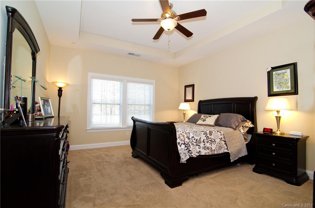 16827 Rudence Court Charlotte, NC 28278 - Photo 11 of 24 a bedroom with a bed window and dresser