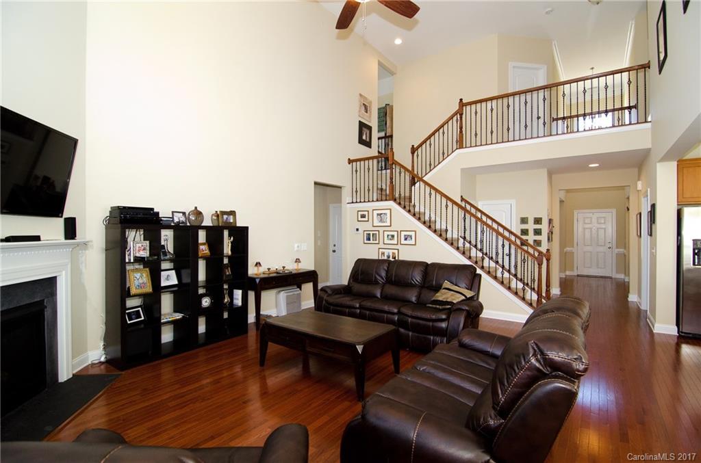 16827 Rudence Court Charlotte, NC 28278 - Photo 5 of 24 a living room with furniture and a flat screen tv