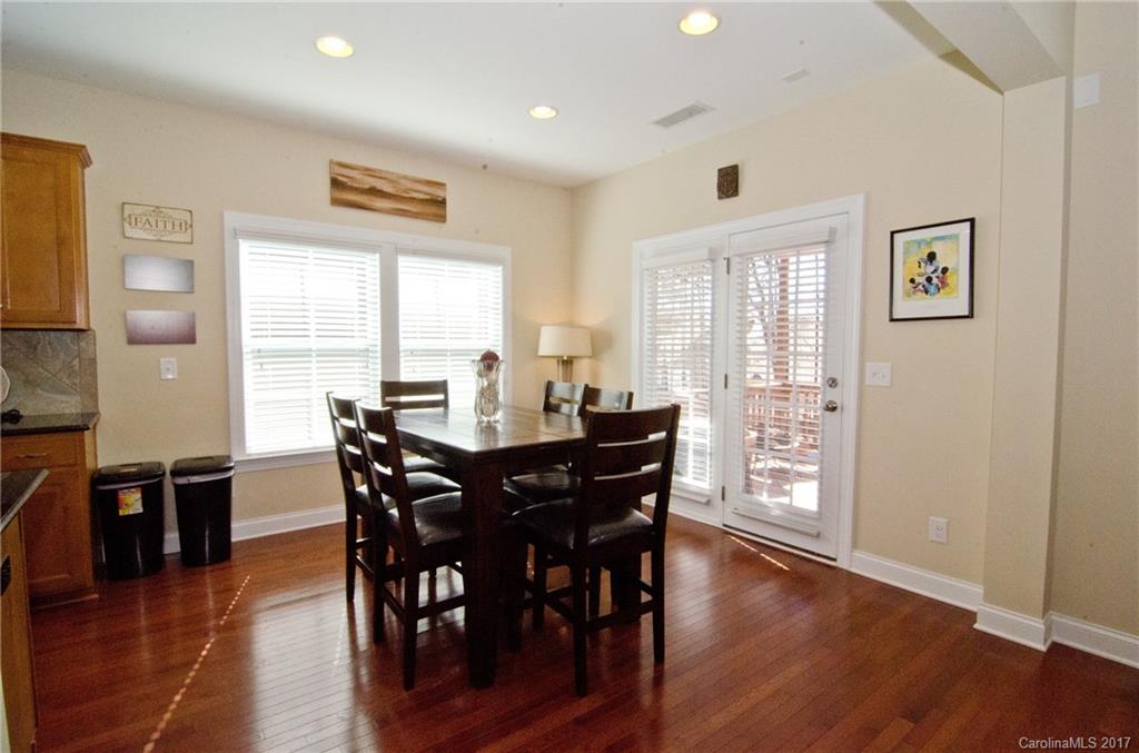 16827 Rudence Court Charlotte, NC 28278 - Photo 9 of 24 a view of a a dining room with furniture window and wooden floor