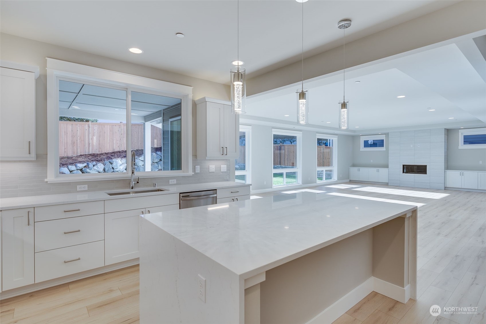 23208 15th Avenue Southeast Bothell, WA 98021 - Photo 11 of 28 a large kitchen with kitchen island a sink stainless steel appliances and cabinets
