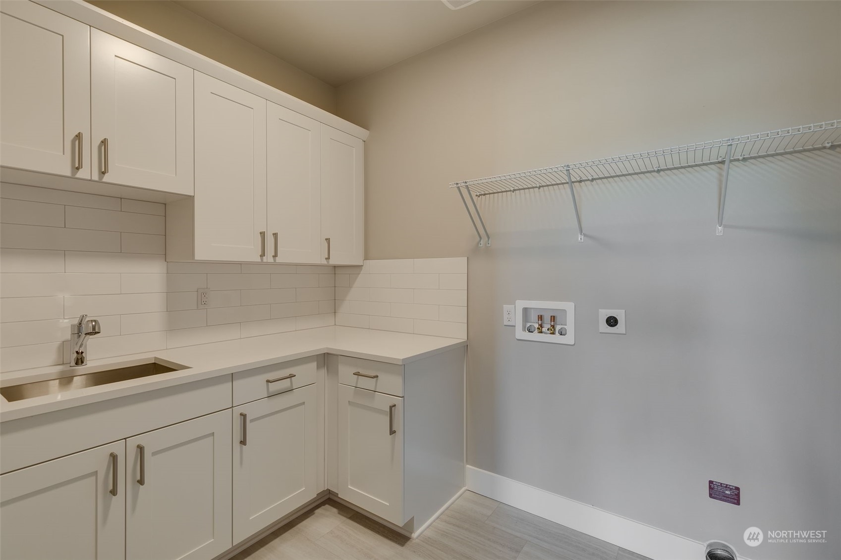 23208 15th Avenue Southeast Bothell, WA 98021 - Photo 22 of 28 a kitchen with a sink and cabinets