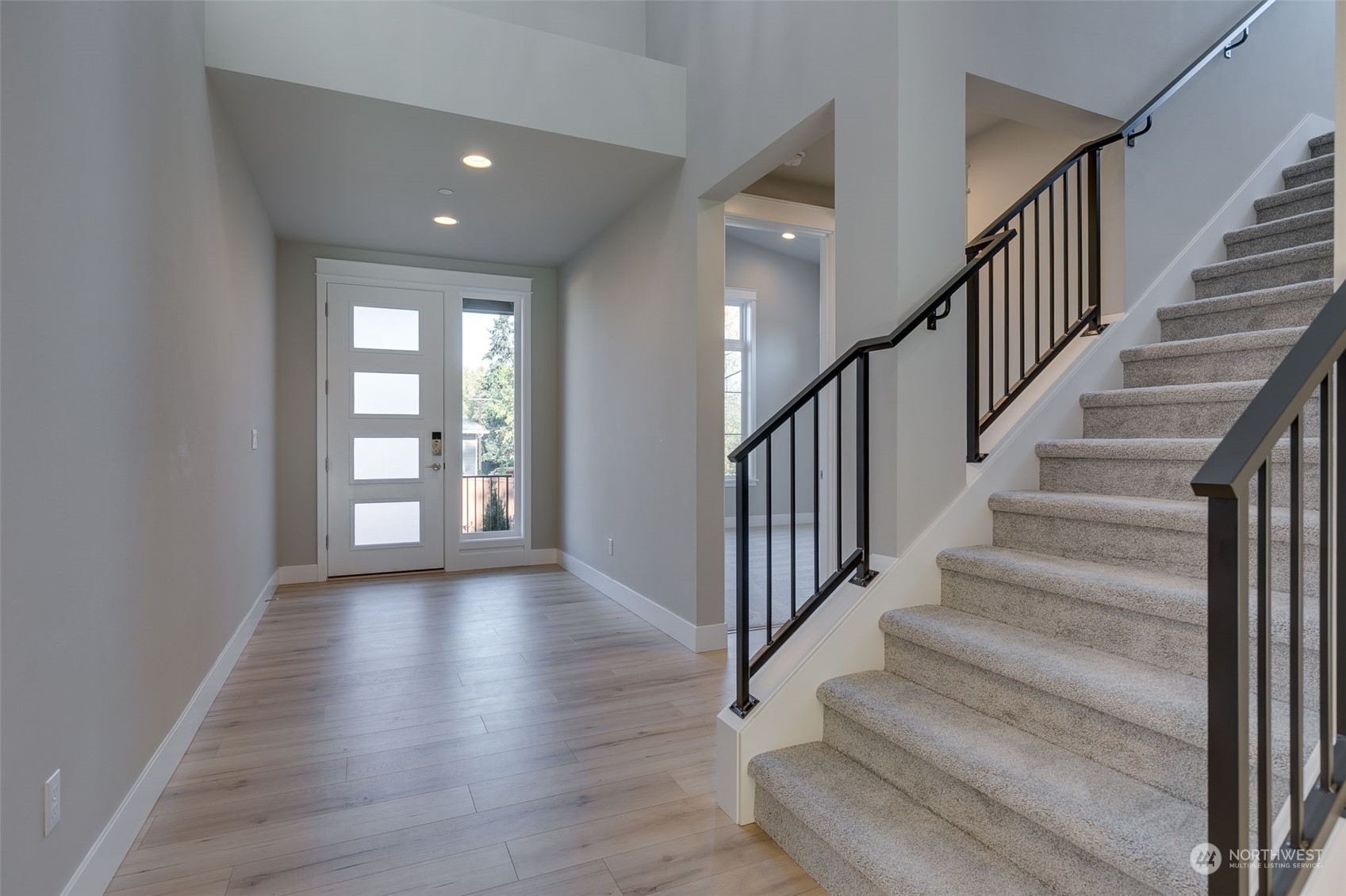 23208 15th Avenue Southeast Bothell, WA 98021 - Photo 3 of 28 a view of staircase with wooden floor and fan