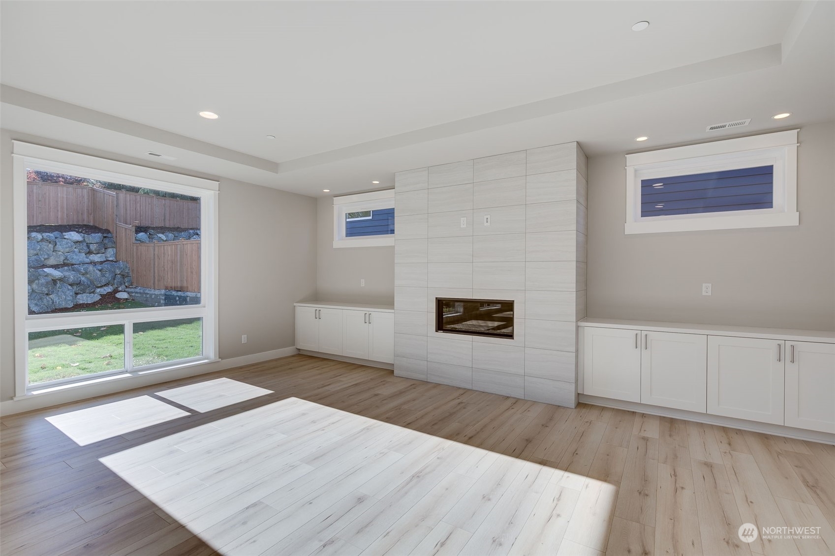 23208 15th Avenue Southeast Bothell, WA 98021 - Photo 8 of 28 a view of an empty room with wooden floor and a window