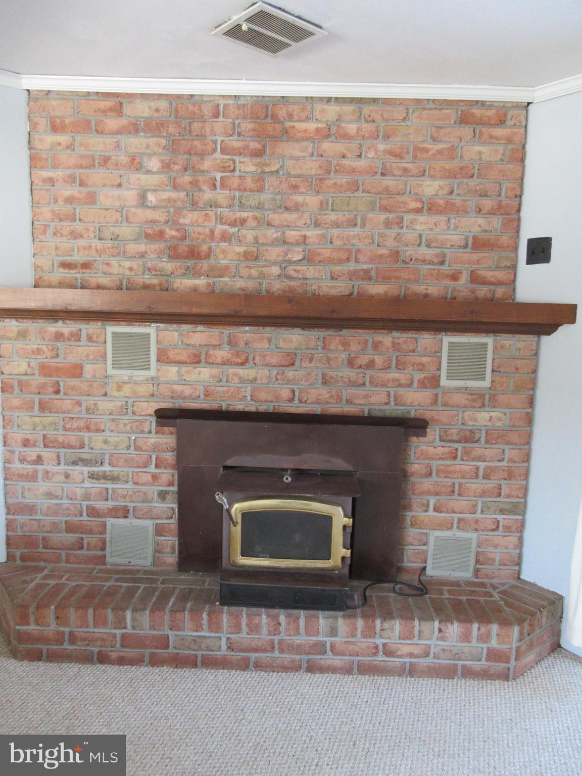 21 Washington Road New Freedom, PA 17349 - Photo 7 of 22 warm woodstove in family room.