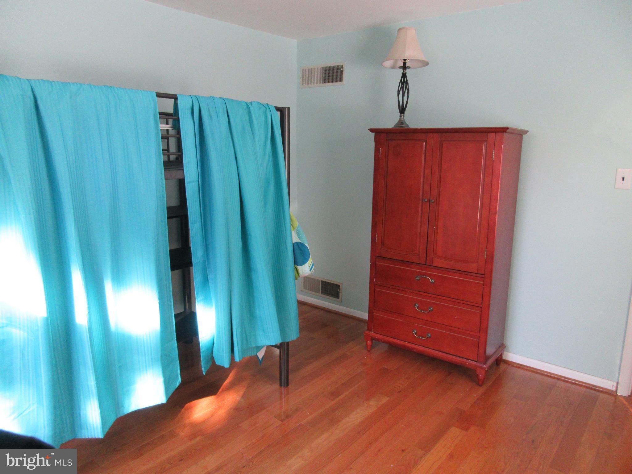 21 Washington Road New Freedom, PA 17349 - Photo 9 of 22 first floor bedroom with hardwood floors.