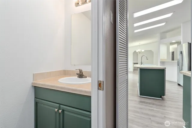 a bathroom with a sink and a mirror