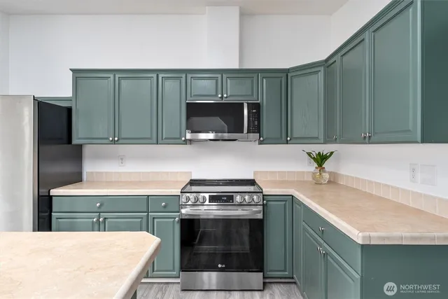 a kitchen with a stove and a microwave