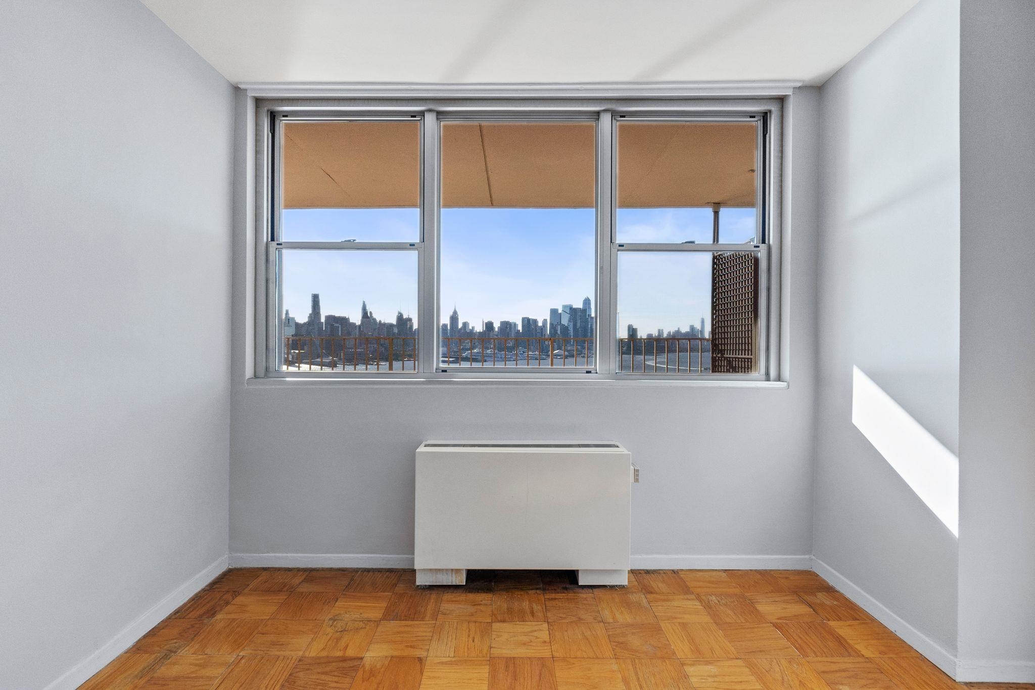 6040 Boulevard East, Unit 14F West New York, NJ 07093 - Photo 20 of 34 a view of a room that has a window