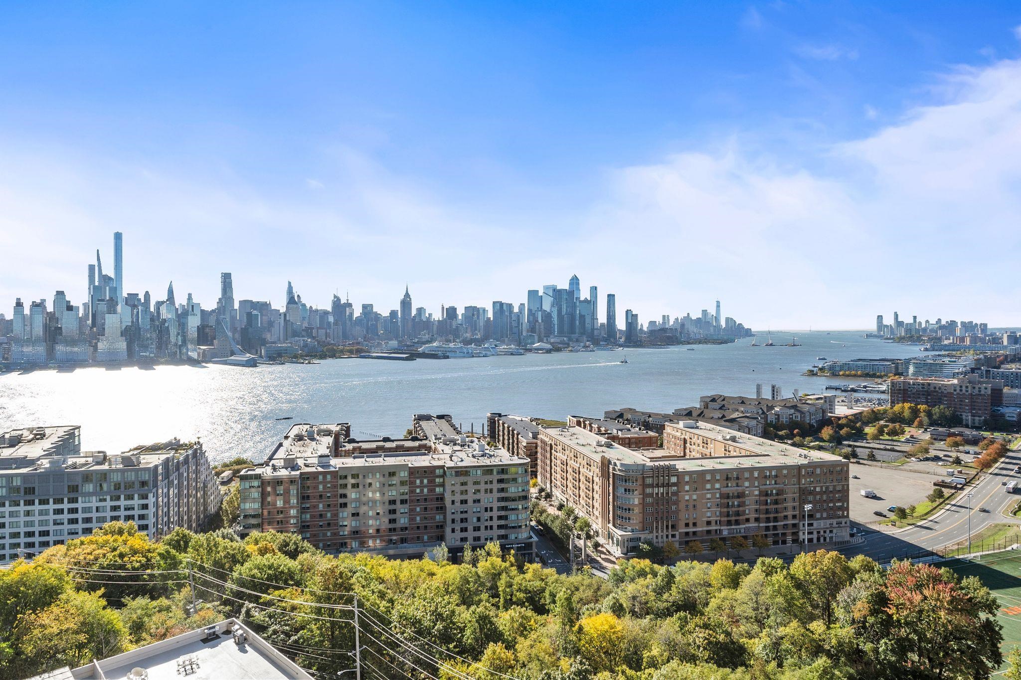 6040 Boulevard East, Unit 14F West New York, NJ 07093 - Photo 3 of 34 a view of a city with tall buildings
