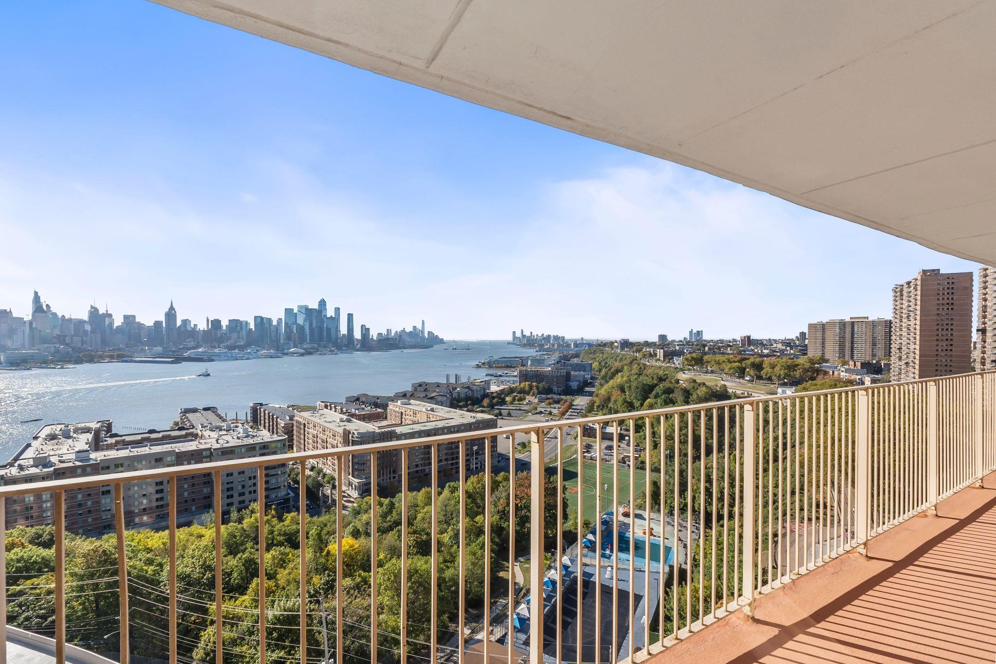 6040 Boulevard East, Unit 14F West New York, NJ 07093 - Photo 4 of 34 a view of a balcony with city view
