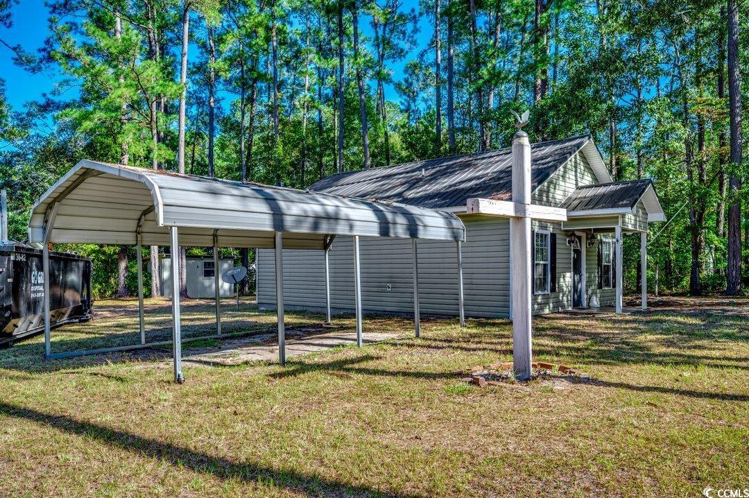 5221 Bottle Branch Road Conway, SC 29527 - Photo 13 of 16 View of car parking with a yard and a carport