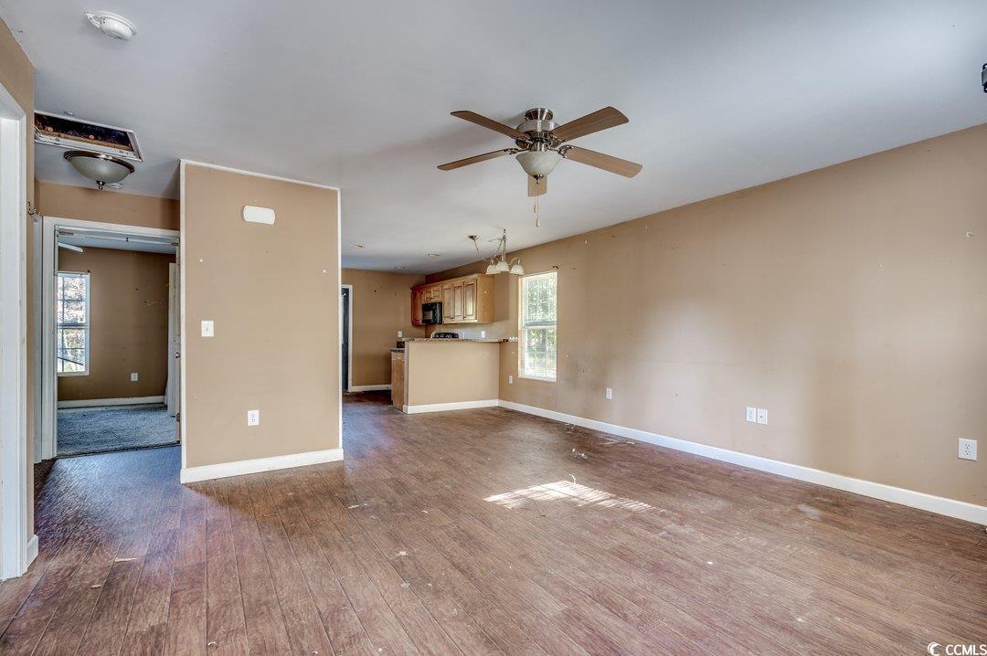 5221 Bottle Branch Road Conway, SC 29527 - Photo 2 of 16 Unfurnished living room with dark wood-type floori