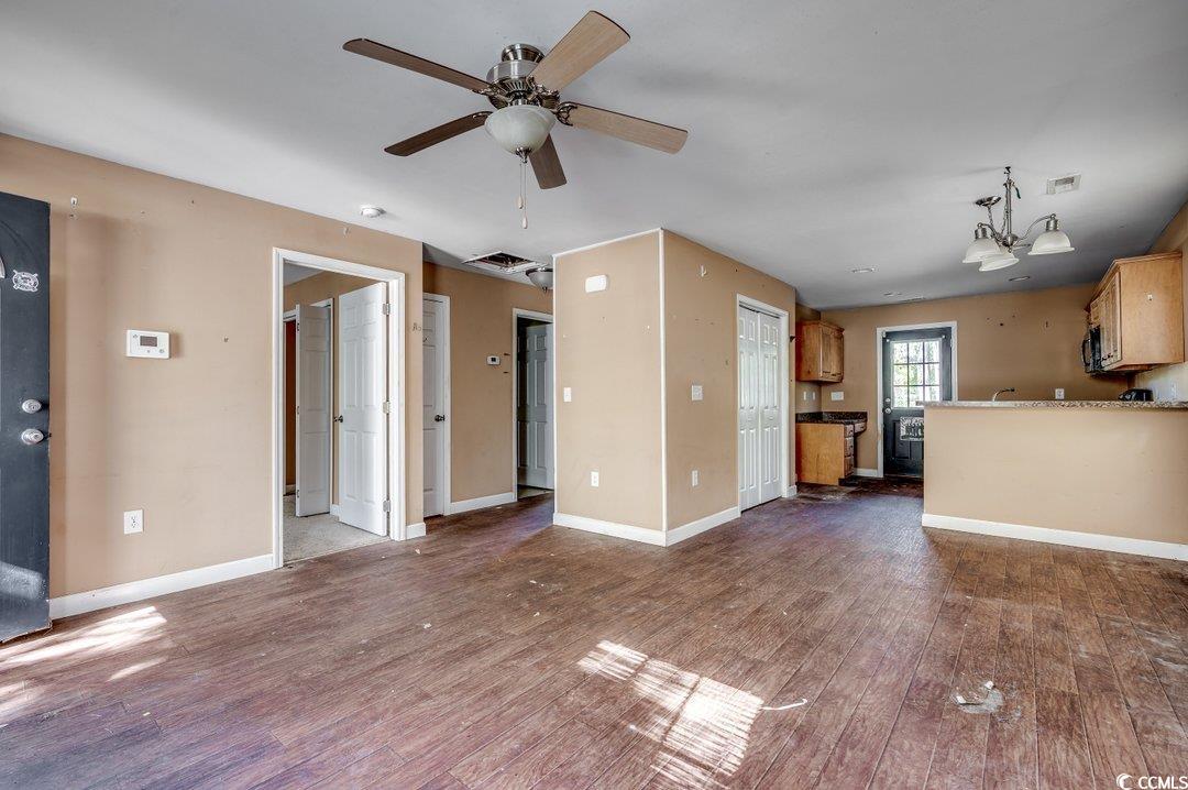 5221 Bottle Branch Road Conway, SC 29527 - Photo 5 of 16 Unfurnished living room featuring dark hardwood /