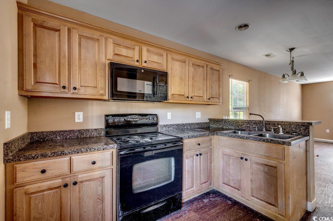5221 Bottle Branch Road Conway, SC 29527 - Photo 6 of 16 Kitchen with a notable chandelier, black appliance