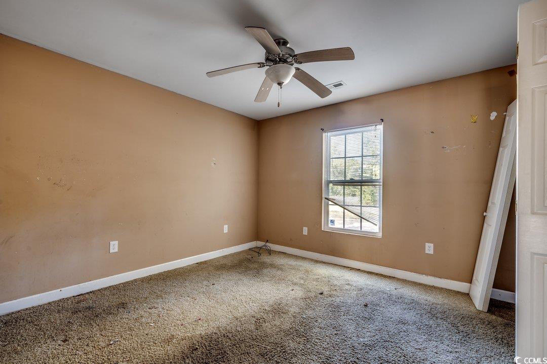 5221 Bottle Branch Road Conway, SC 29527 - Photo 8 of 16 Carpeted empty room featuring ceiling fan