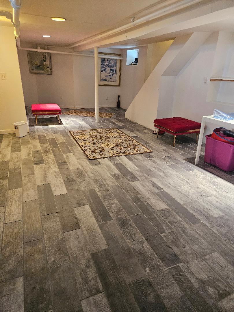 84-24 85th Road Queens, NY 11421 - Photo 9 of 10 a view of a room with stairs