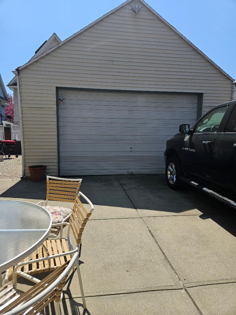 84-24 85th Road Queens, NY 11421 - Photo 10 of 10 a car parked in front of a house