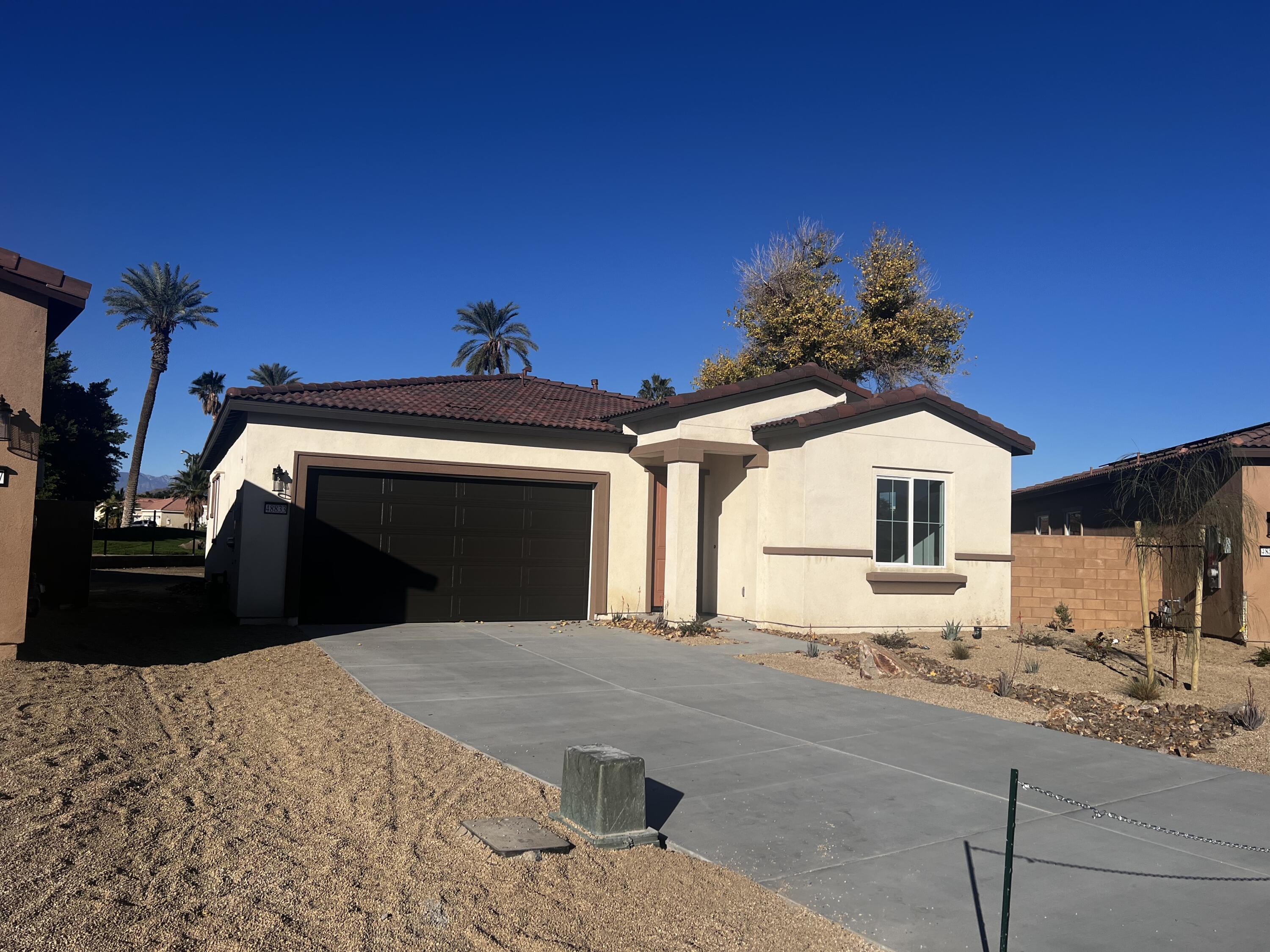 48833 Patton Lane Indio, CA 92201 - Photo 11 of 12 a view of a house with a snow in the yard