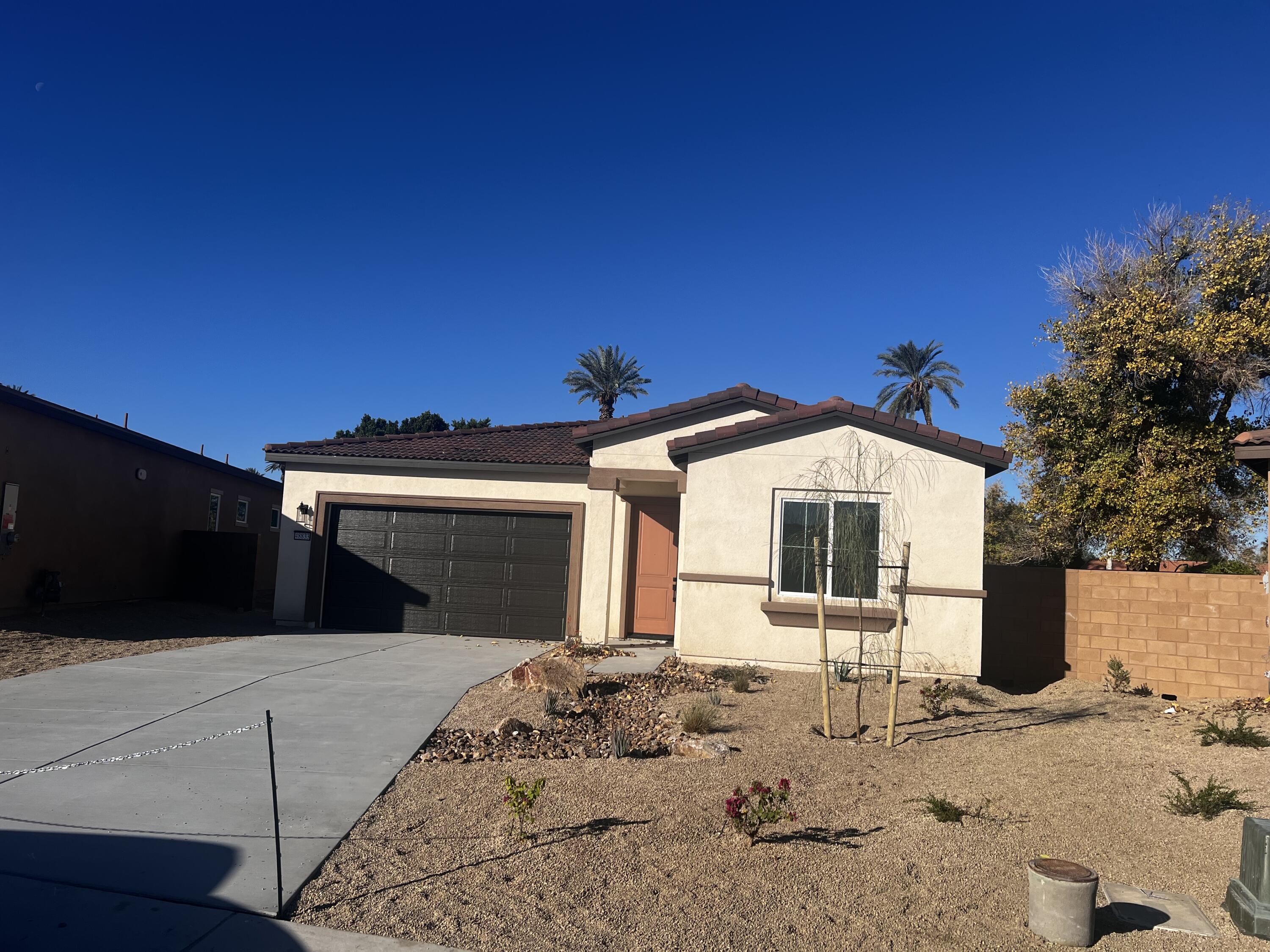 48833 Patton Lane Indio, CA 92201 - Photo 12 of 12 a front view of a house with a yard