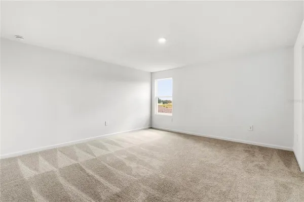 a view of an empty room and window