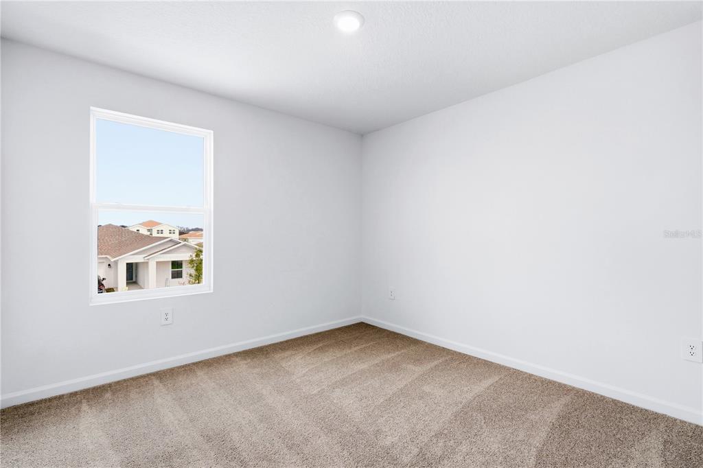 3644 Rolling Rdg Bend Davenport, FL 33837 - Photo 18 of 31 an empty room with a window