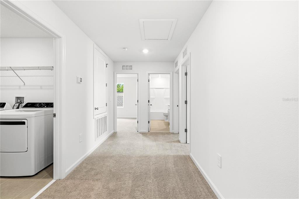 3644 Rolling Rdg Bend Davenport, FL 33837 - Photo 21 of 31 a view of a hallway with white walls and white walls