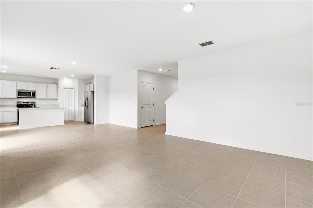 3644 Rolling Rdg Bend Davenport, FL 33837 - Photo 8 of 31 a view of a kitchen with a sink and a refrigerator