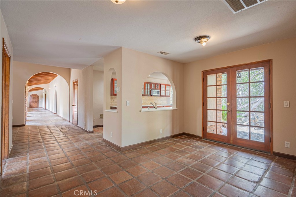 48703 De Luz Road Temecula, CA 92590 - Photo 14 of 36 a view of a hallway with windows and entryway