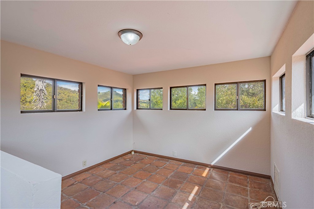 48703 De Luz Road Temecula, CA 92590 - Photo 19 of 36 a view of an empty room with a window
