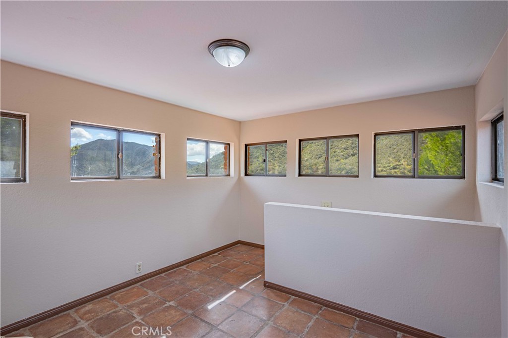 48703 De Luz Road Temecula, CA 92590 - Photo 20 of 36 an empty room with windows