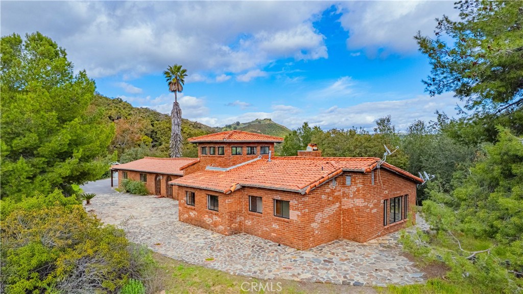 48703 De Luz Road Temecula, CA 92590 - Photo 2 of 36 an aerial view of a house with a yard