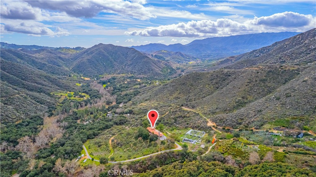 48703 De Luz Road Temecula, CA 92590 - Photo 3 of 36 a view of top of a house with a mountain