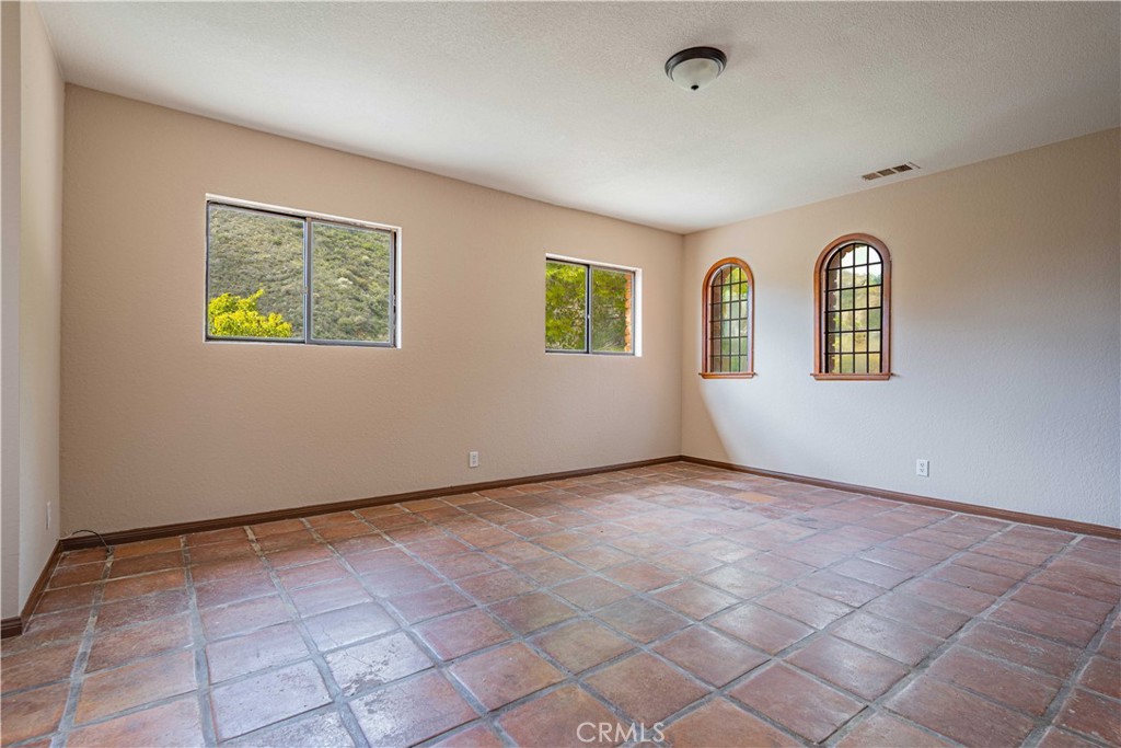 48703 De Luz Road Temecula, CA 92590 - Photo 31 of 36 a view of an empty room with windows