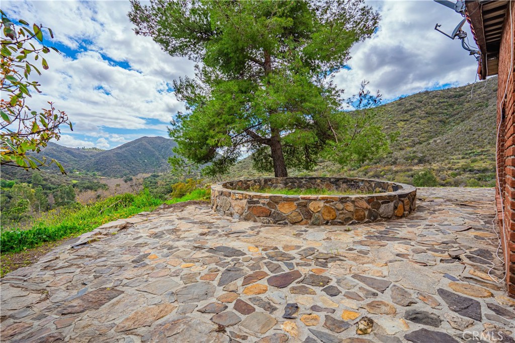 48703 De Luz Road Temecula, CA 92590 - Photo 32 of 36 a view of a dry yard with wooden fence