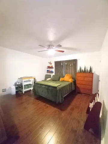 a bedroom with furniture and window