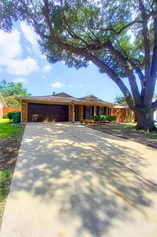 a view of a big yard next to a house