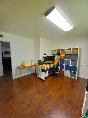 a living room with furniture and a pool table