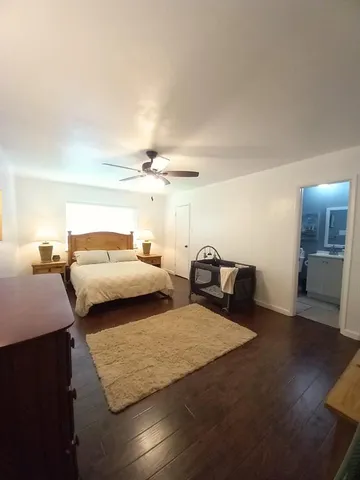 a bedroom with double bed and a night stand