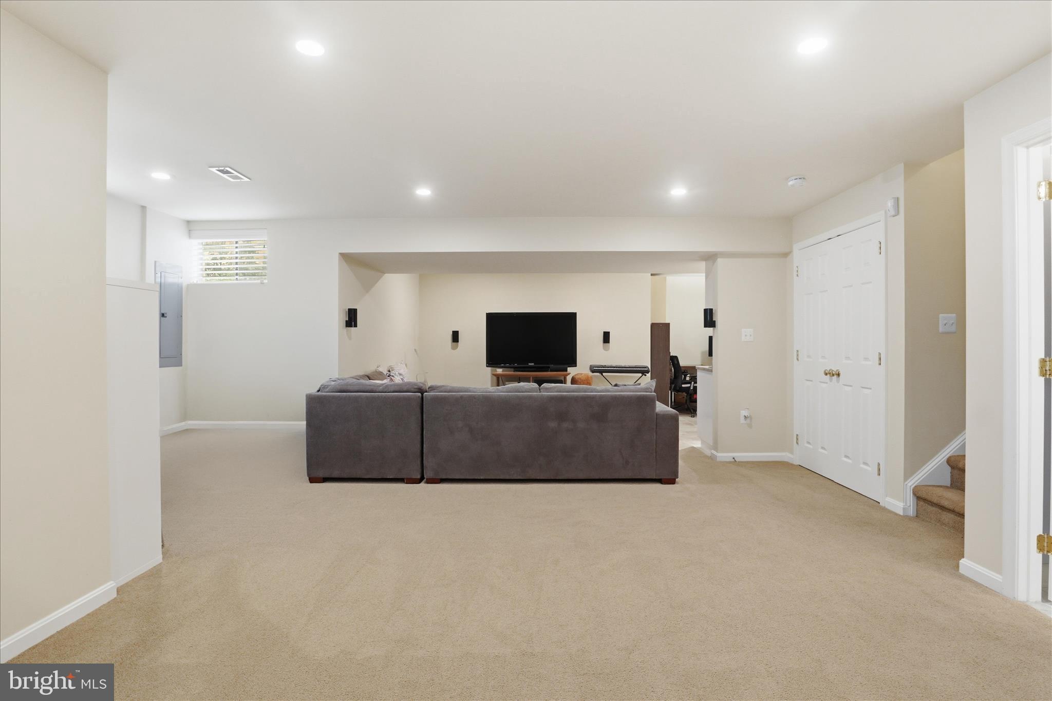 25352 Ripleys Field Drive Chantilly, VA 20152 - Photo 25 of 54 a living room with furniture and a flat screen tv