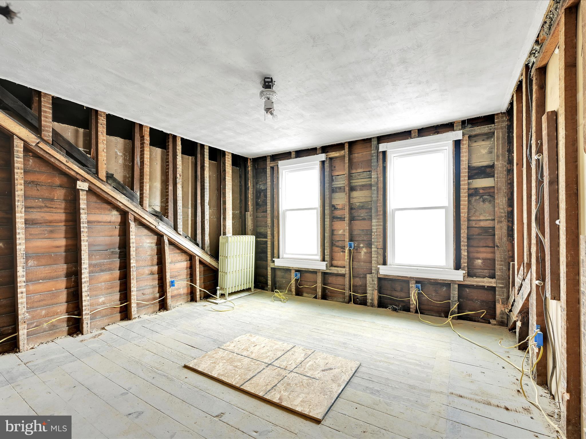 427 East Centre Street Mahanoy City, PA 17948 - Photo 11 of 29 a spacious bedroom with a bed and a large window