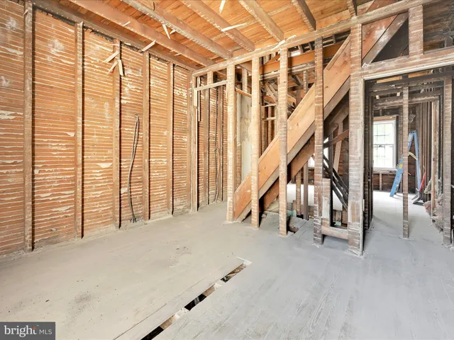a view of an empty room with stairs