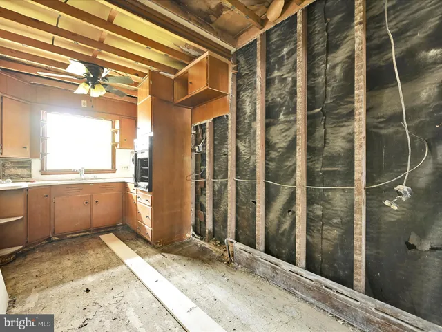 a view of a bathroom with a shower and a sink